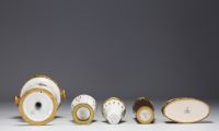Sèvres - Ensemble de quatre vases et d'une coupe en porcelaine et monture en bronze doré, marque au bleu.