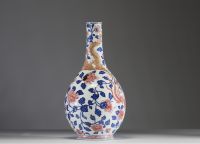 China - Polychrome porcelain vase decorated with a dragon, a phoenix and copper-red peony flowers, Qianlong period.