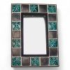 Miroir en céramique ornée de carreaux décorés d'un animal fantastique
