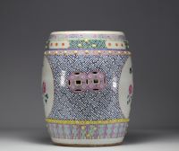 China - A famille rose porcelain stool decorated with peonies and birds in cartouches, circa 1900