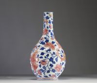 China - Polychrome porcelain vase decorated with a dragon, a phoenix and copper-red peony flowers, Qianlong period.