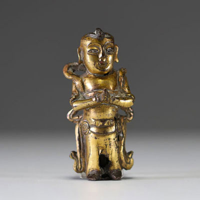 China - Ming period gilt bronze figurative statue of a servant.