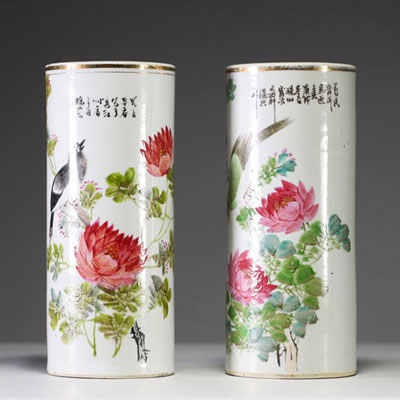 China - A pair of Qianjiang cai polychrome porcelain scroll vases decorated with peonies and birds, circa 1900.