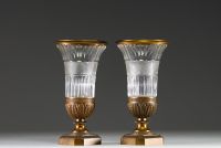 Baccarat - Paire de vases Empire en cristal, montures en bronze doré et ciselé.