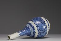 China - A white-blue porcelain vase with floral decoration, Yongzheng mark, 19th century.