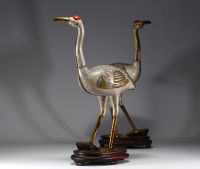 China - Large pair of cranes in cloisonné enamel on a wooden base, 19th century.