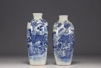 China - Pair of blue-white porcelain vases with floral and poem decoration, 19th century.