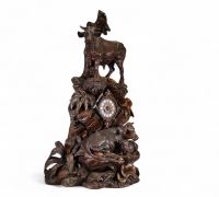 Switzerland, 19th century - Black Forest clock in carved wood