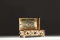Silver and vermeil jewellery box, lid surmounted by a galleon, inlaid with cabochon semi-precious stones and pearls around the rim, Austria, 18th-19th century.