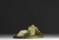 Amalric WALTER (1870-1959) - Sculpture in pink and green glass paste in high relief depicting a young girl lying in the waves, signed.