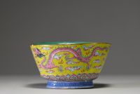 China - A pink family polychrome porcelain bowl decorated with an Imperial dragon on a yellow background, Tao Kuang mark and period.