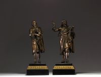 ‘Molière and Corneille’ Pair of bronze sculptures with brown patine on black marble base and gilded bonze, 19th century.