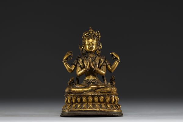 China - Tibet - A 17th century ormolu figure of Shadakshari Lokeshvara.