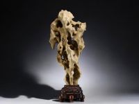 China - ‘Dream Stone’ sculpture, hard stone on wooden base, 19th century.