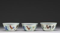 China - Set of three porcelain bowls decorated with roosters, hens and chicks in Ducaï enamels.