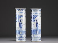 China - Pair of blue-white porcelain vases decorated with ladies and bats, Kanjxi mark, 19th century.