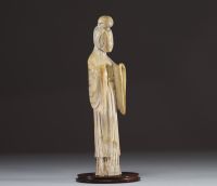 China - Guanyin, ivory sculpture on an exotic wood base, Ming period.