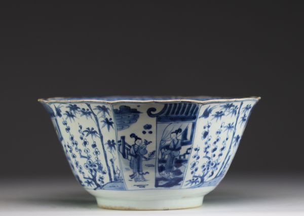 China - Large blue-white porcelain bowl with floral decoration and figures, Kangxi.