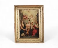 La Sainte Famille entourée de saints et anges Huile sur toile,  fin XVIIe – début XVIIIe siècle  dans un cadre en bois doré à décor de perles.