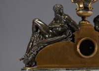 Imposing ormolu and patinated mantel clock decorated with antique figures, marble base, 19th century.