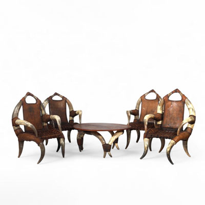 Set of four ethnic armchairs and table in buffalo horn and leather, circa 1970-80