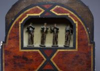 Four-piece organ clock, painted dial, Roman numerals, early 19th century.