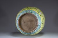 China - Imposing pink family polychrome porcelain vase with floral decoration on a yellow background, handles depicting dragons, 20th century.