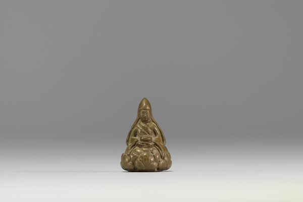 China - Tibet - Lama on lotus flower, miniature bronze sculpture.