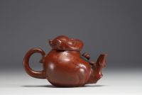 China - Yixing clay teapot in the shape of a monkey, debossed mark on the underside.