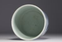 China - A white and blue porcelain brush with landscape decoration.