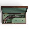Pistolet de tir de type Flaubert, canon octogonal ciselé, crosse en noyer, XIXème, en coffret.