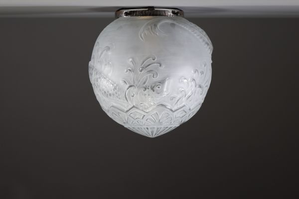 Le Lorrain - Molded and sandblasted glass ceiling light globe with fish decoration.