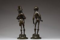 Émile GUILLEMIN (1841-1907) Suite de deux personnages grotesques en bronze patiné dans le style Daumier, signés sur la terrasse.
