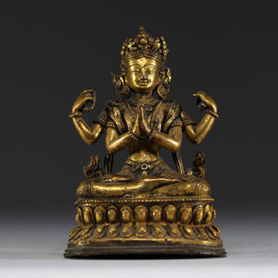 China - Tibet - A 17th century ormolu figure of Shadakshari Lokeshvara.