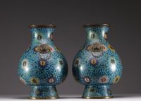 China - Pair of bronze vases in cloisonné enamel with lotus and foliage decoration, handles with taotie heads, Ming period.
