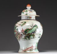 China - Covered vase in green family polychrome porcelain decorated with characters, circle mark under the piece.