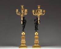 ‘Amour et Psyché’ Elegant pair of candelabra in chased gilt bronze with black patina, from the Empire period.