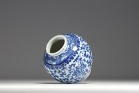 China - A white-blue porcelain vase with floral decoration, 19th-20th century.