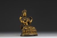 China - Tibet - A 17th century ormolu figure of Shadakshari Lokeshvara.