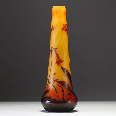 DAUM Nancy - Vase in acid-etched multi-layered glass decorated with flowers and tobacco leaves, signed in the decoration.