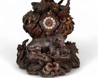 Switzerland, 19th century - Black Forest clock in carved wood