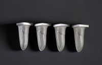 Suite of four Art Deco sconces in pressed moulded glass with stylised geometric decoration and nickel-plated metal, circa 1930.