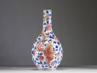 China - Polychrome porcelain vase decorated with a dragon, a phoenix and copper-red peony flowers, Qianlong period.