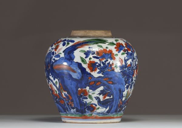 China - A polychrome porcelain vase decorated with flowers, trees and birds, 17th century.