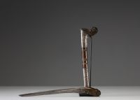 Malaysia - Kriss, horn handle, wooden and silver scabbard, hammered steel blade, 19th century.