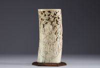 Japan - Carved ivory vase on a wooden base Meiji period circa 1900.