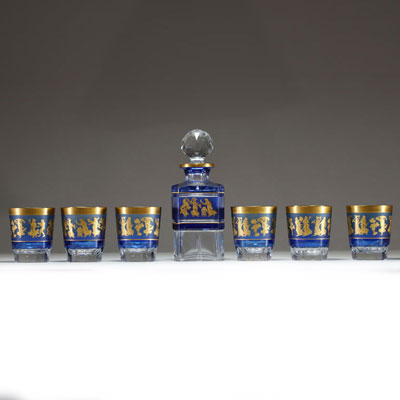 Val Saint Lambert - ‘La Danse de Flore’ Box comprising a carafe and six blue and gold lined crystal glasses, signed VSL.