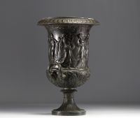 A Medici vase in bronzed brass with a black patina, decorated with a Bacchanalian frieze in the antique style, 19th century.