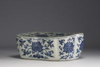 China - Headrest in white-blue porcelain with floral decoration.
