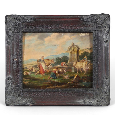 École européenne du XVIIe ou XVIIIe siècle Scène pastorale à la fontaine, huile sur panneau.Charmante scène champêtre animée de bergères, troupeaux de chèvres, vaches et moutons rassemblés autour d'un
